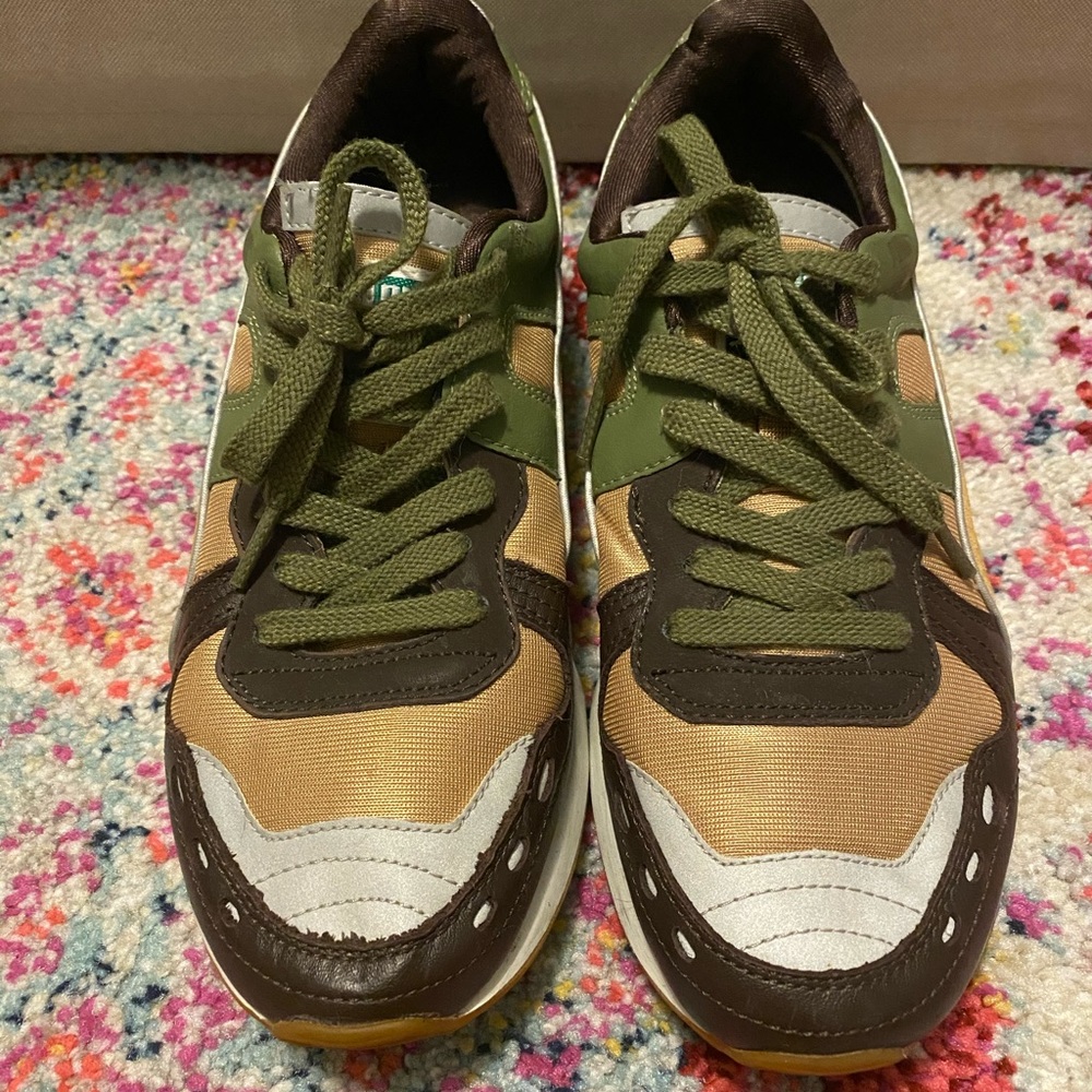 Brown gold and green athletic Puma sneakers